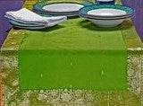 Forest green silk table runner running down a dining table