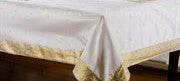 White sari tablecloth laid on a dining table