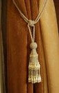 Off white sari curtain tiebacks holding a panel open