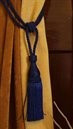 Blue sari curtain tiebacks holding a panel open