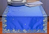 Blue silk table runner running down a dining table