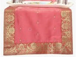 Peach silk table runner running down a dining table