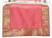Peach silk table runner running down a dining table