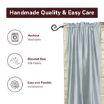 Gray sari rod pocket curtains hung at a window