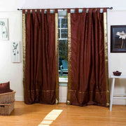 Brown sari tab top curtains hung at a window