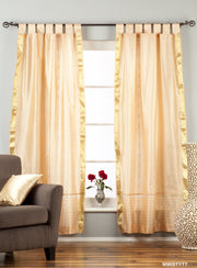 Misty rose sari tab top curtains hung at a window