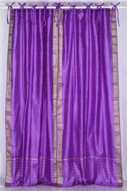 Lavender sari tie top curtains hung at a window