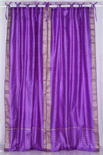 Lavender sari tie top curtains hung at a window