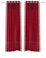 Fire brick sari grommet top curtains hung at a window