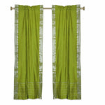 Olive green sari rod pocket curtains hung at a window