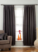Black sari tab top curtains hung at a window