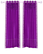 Violet sari grommet top curtains hung at a window