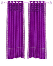 Violet sari grommet top curtains hung at a window