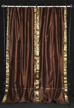 Brown sari tie top curtains hung at a window