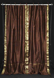 Brown sari tie top curtains hung at a window