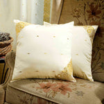 Cream sari cushion covers arranged on a sofa