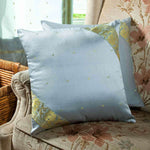 Gray sari cushion covers arranged on a sofa