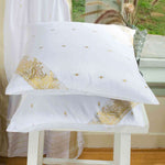 White sari cushion covers arranged on a sofa