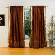 Brown sari rod pocket curtains hung at a window