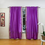 Lavender sari rod pocket curtains hung at a window