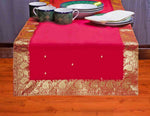 Fire brick silk table runner running down a dining table