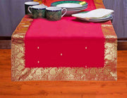 Fire brick silk table runner running down a dining table