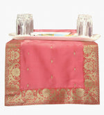 Peach silk table runner running down a dining table