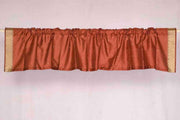 Rust sari valance mounted above a window