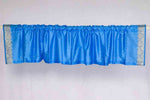 Blue sari valance mounted above a window