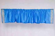 Blue sari valance mounted above a window