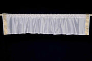 White sari valance mounted above a window