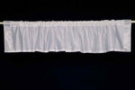 Silver sari valance mounted above a window