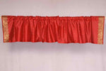 Fire brick sari valance mounted above a window