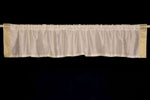 Cream sari valance mounted above a window
