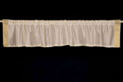 Cream sari valance mounted above a window
