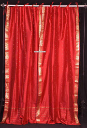 Fire brick sari tie top curtains hung at a window