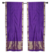 Purple sari rod pocket curtains hung at a window