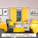 Yellow sari tab top curtains hung at a window
