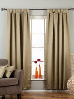 Olive green sari tab top curtains hung at a window