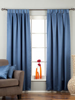 Blue sari tab top curtains hung at a window