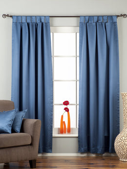 Blue sari tab top curtains hung at a window