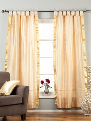 Misty rose sari tab top curtains hung at a window