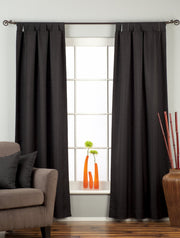 Black raw silk tab top curtains hung at a window
