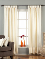 Cream sari tab top curtains hung at a window