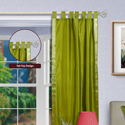 Olive green sari tab top curtains hung at a window