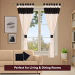 Cream raw silk curtain and cushion cover set shown together