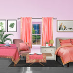 Pink sari rod pocket curtains hung at a window