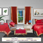Rust sari rod pocket curtains hung at a window