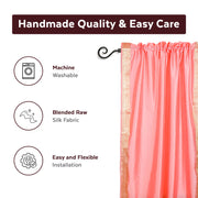 Pink sari rod pocket curtains hung at a window