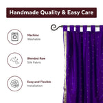 Purple sari tab top curtains hung at a window